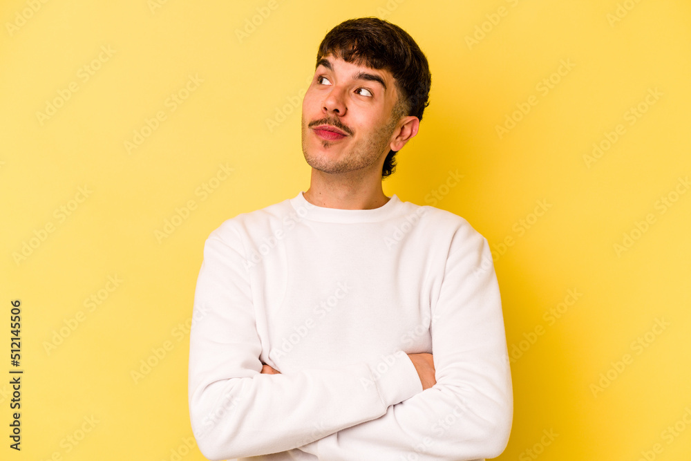 Young caucasian man isolated on yellow background dreaming of achieving goals and purposes Young caucasian man isolated on yellow background dreaming of achieving goals and purposes