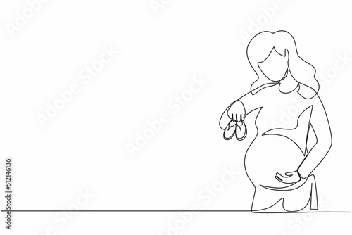 Single continuous line drawing small shoes for unborn baby in belly of pregnant woman. Pregnant woman holding small baby shoes relaxing at home in bedroom. Dynamic one line draw graphic design vector
