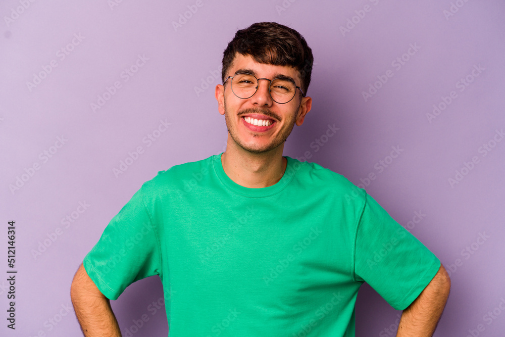 Obraz premium Young caucasian man isolated on purple background happy, smiling and cheerful.