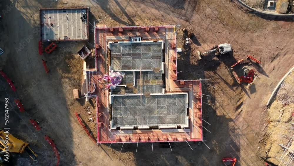 Rising generic aerial view of a housing development and construction site