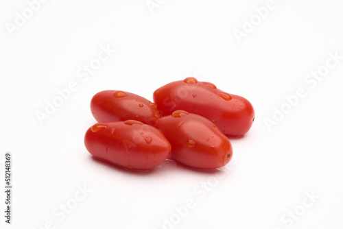 Cherub Tomatoes with drops of water isolated on white background