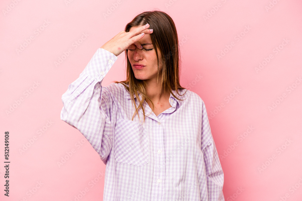 Young caucasian pregnant woman isolated on white background having a head ache, touching front of the face. Young caucasian pregnant woman isolated on white background having a head ache, touching front of the face.