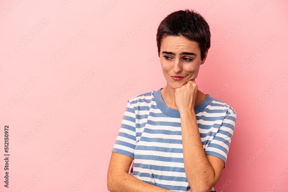 Young caucasian woman isolated on blue background looking sideways with doubtful and skeptical expression. Young caucasian woman isolated on blue background looking sideways with doubtful and skeptical expression.