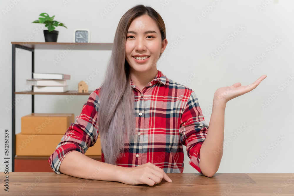 A young businesswoman is very happy after checking her email through her laptop. A young businesswoman is very happy after checking her email through her laptop.