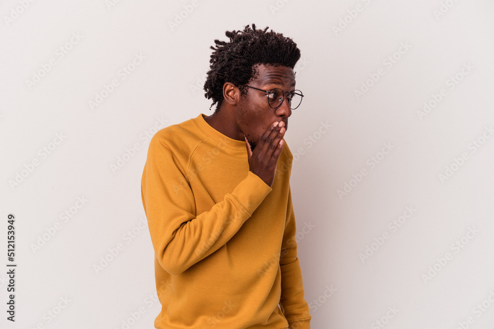 Young african american man isolated on white background being shocked because of something she has seen. Young african american man isolated on white background being shocked because of something she has seen.