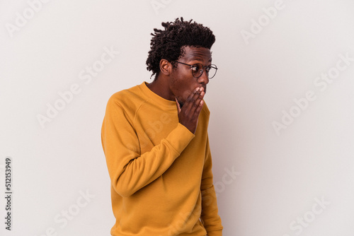 Young african american man isolated on white background  being shocked because of something she has seen.