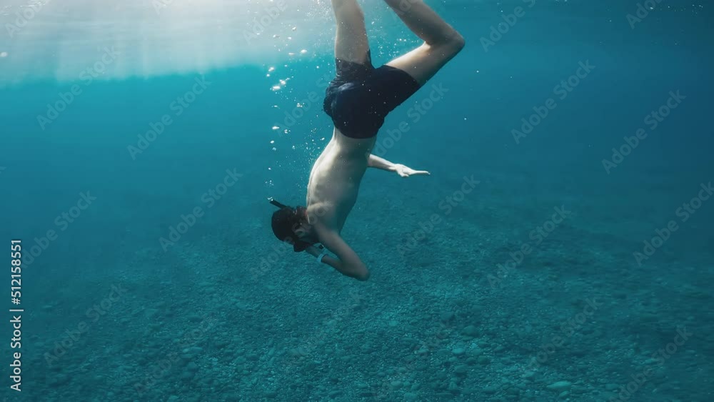 Exploring the ocean underwater with mask and fins Exploring the ocean underwater with mask and fins