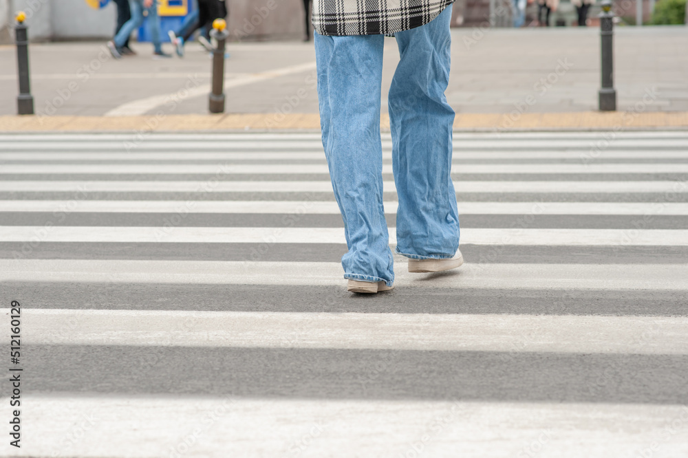 Man crossing street in city, closeup view Man crossing street in city, closeup view