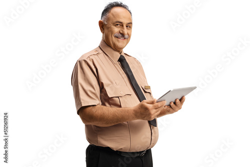 Smiling mature security officer using a digital tablet © Ljupco Smokovski
