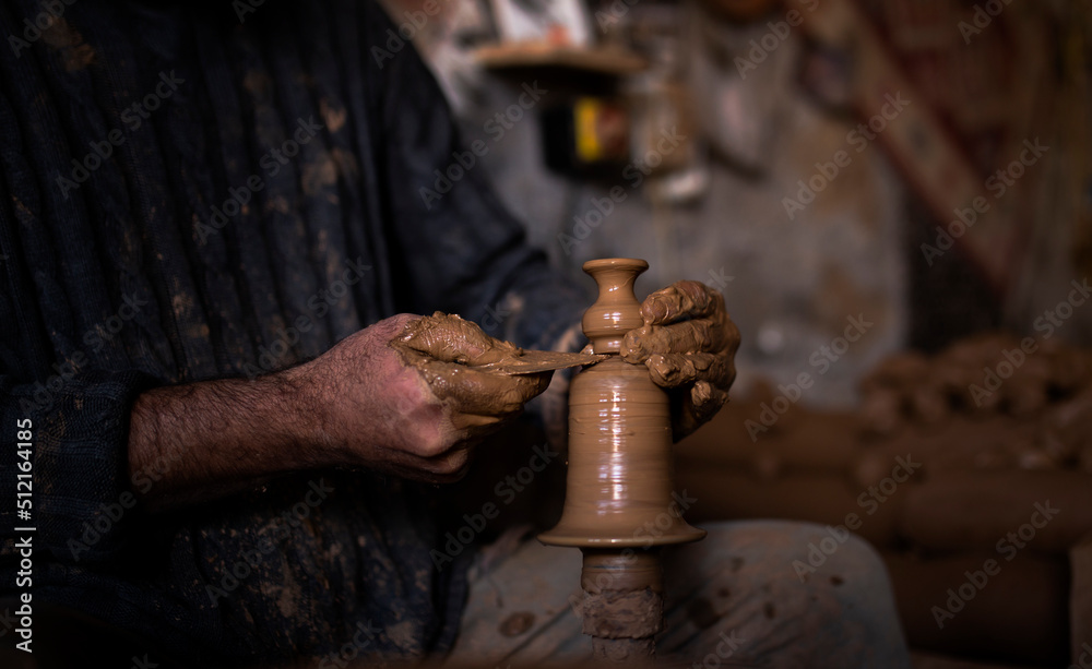 hands of a potter,making a jug, handicrafts, mud art, human silhouette, Cappadocia symbol, cultural trip, places to visit, making a plate from mud, backlight, shadow in photography,