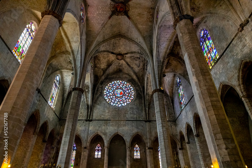 Interior view of the stained glass rose window and ceiling of the Basilica of Santa Maria del Mar church in the Ribera district near the Gothic Quarter of Barcelona, Spain. photo
