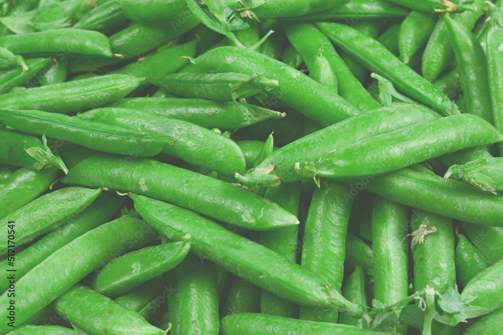 Fresh pea pods as background. Top view. Fresh pea pods as background. Top view.