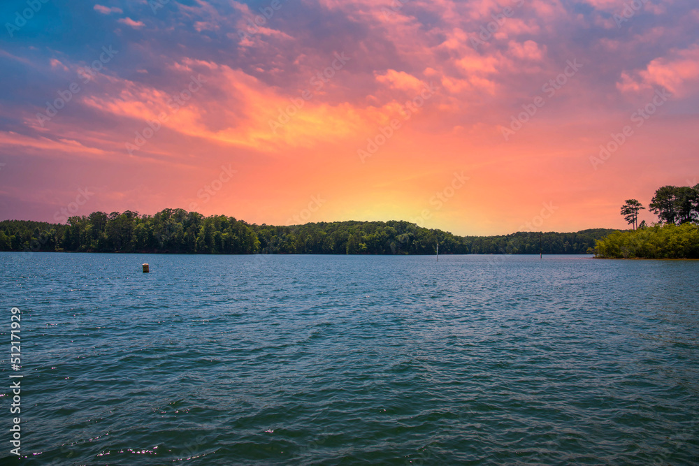 a gorgeous summer landscape at Lake Allatoona with rippling blue lake water  surrounded by lush green