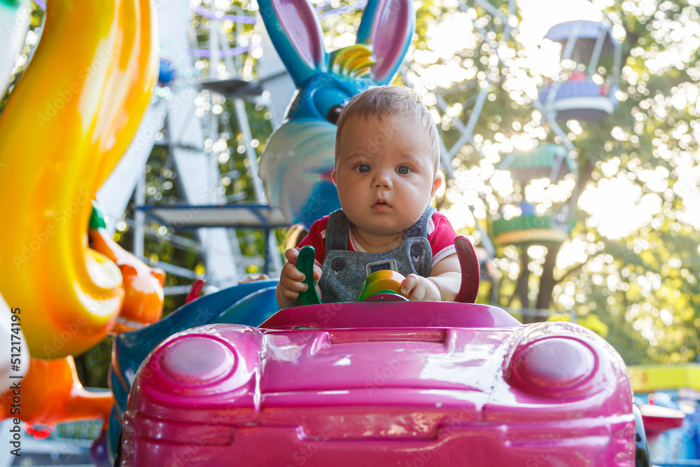 handsome little boy on amusement ride machine handsome little boy on amusement ride machine