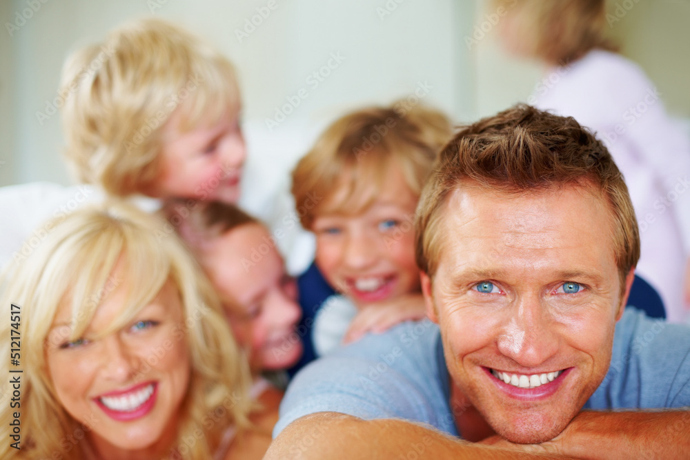 Happy mature man with his family enjoying together. Portrait of a happy mature man with his family enjoying together. Happy mature man with his family enjoying together. Portrait of a happy mature man with his family enjoying together.