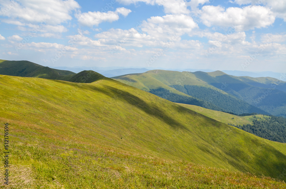 Picturesque landscape with mountain range, green slopes and alpine meadow at summer day. Carpathian Mountains, Ukraine