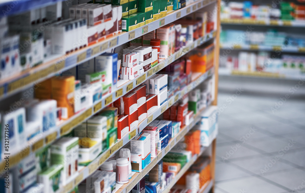 Broad spectrum of brands to get your better. Shot of shelves stocked with various medicinal products in a pharmacy.