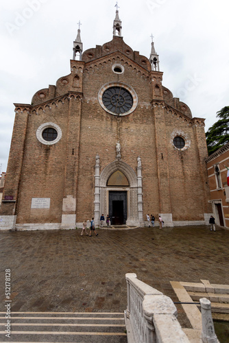 The Church of Santa Maria Gloriosa dei Frari in Venice on a rainy summer day photo