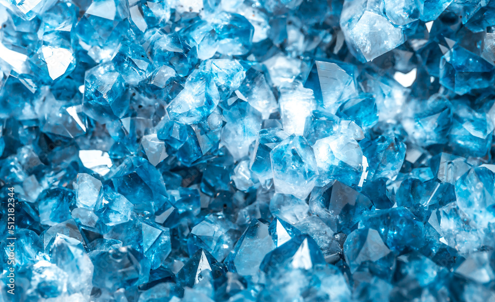 Blue Crystal Mineral Stone. Gems. Mineral crystals in the natural environment. Texture of precious and semiprecious stones. Seamless background with copy space colored shiny surface of precious stones Blue Crystal Mineral Stone. Gems. Mineral crystals in the natural environment. Texture of precious and semiprecious stones. Seamless background with copy space colored shiny surface of precious stones