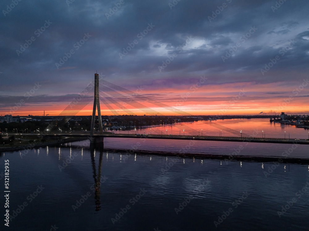 Bridge over river Daugava in Riga, Latvia during beautiful summer sunset.