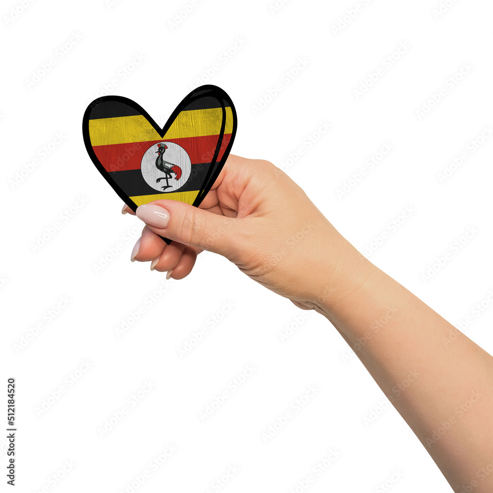 Fototapeta premium Woman hand is holding heart. Peace concept on white background. Uganda