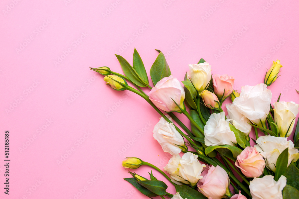 Obraz premium Festive bouquet of flowers for the beloved on a pink background. The concept of love congratulations on the wedding, March 8, Valentine's Day, Christmas and birthday. Copy space.