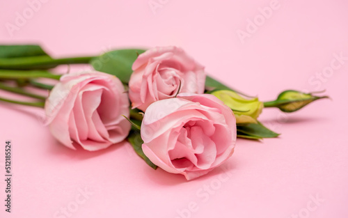 Festive bouquet of flowers for the beloved on a pink background. The concept of love congratulations on the wedding, March 8, Valentine's Day, Christmas and birthday. Copy space. © Vera