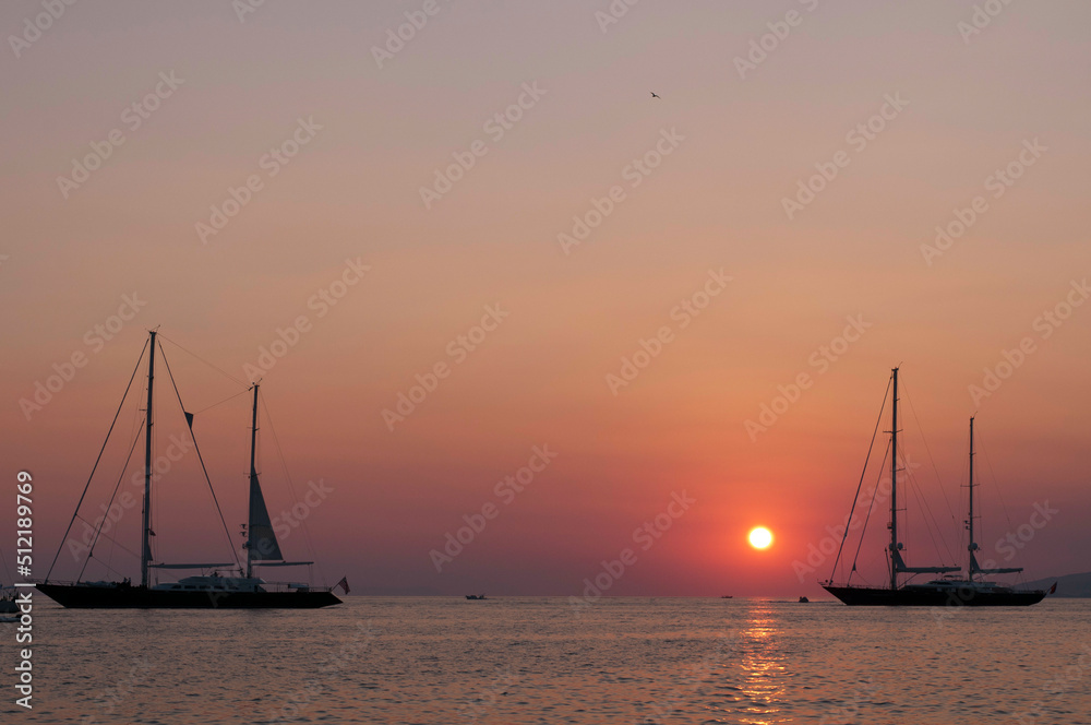 Silhouette of boats at sunset, Mykonos Town, Mykonos, Cyclades Islands, Greece Silhouette of boats at sunset, Mykonos Town, Mykonos, Cyclades Islands, Greece