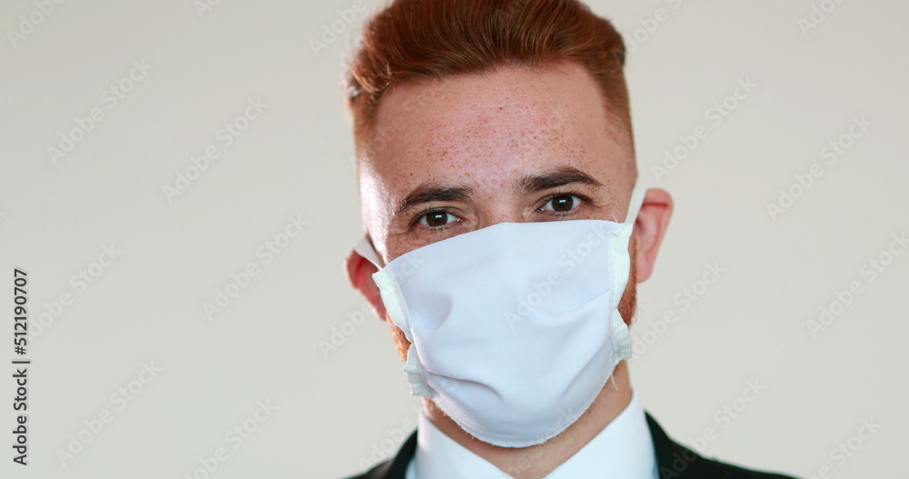 Person removing face mask after pandemic, man feeling relief Person removing face mask after pandemic, man feeling relief