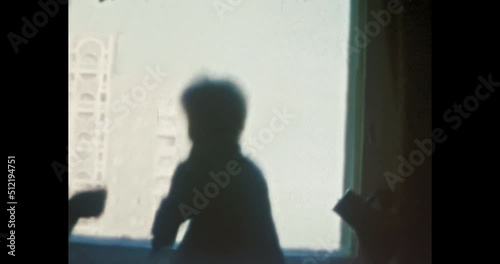 Happy mother and child play together in apartment. Smiling child plays with mother. Happy family in Soviet apartment building. Family life indoors. Vintage color film. Family archive. Retro 1980s. 4k