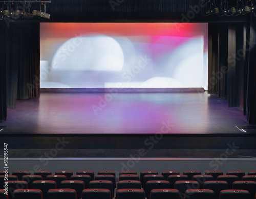 Spotlights shining on stage in theatre photo