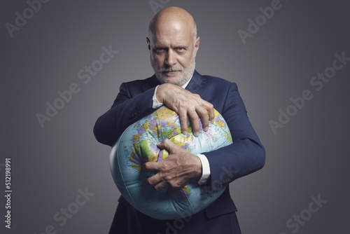 Obraz na plátne Greedy corporate businessman crushing and exploiting earth