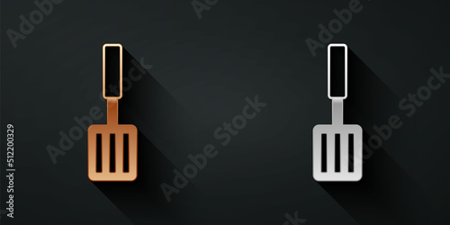 Gold and silver Barbecue spatula icon isolated on black background. Kitchen spatula icon. BBQ spatula sign. Barbecue and grill tool. Long shadow style. Vector