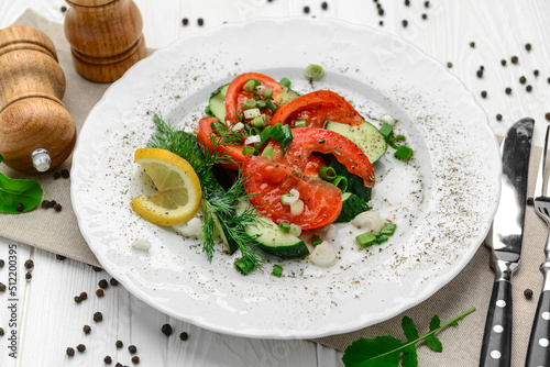 Cucumber, tomato and green onion salad with olive oil