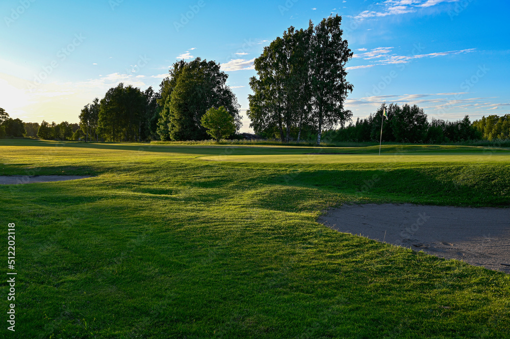 evening light over golf course in Kumla Sweden