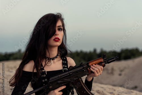 Girl with a gun in her hands