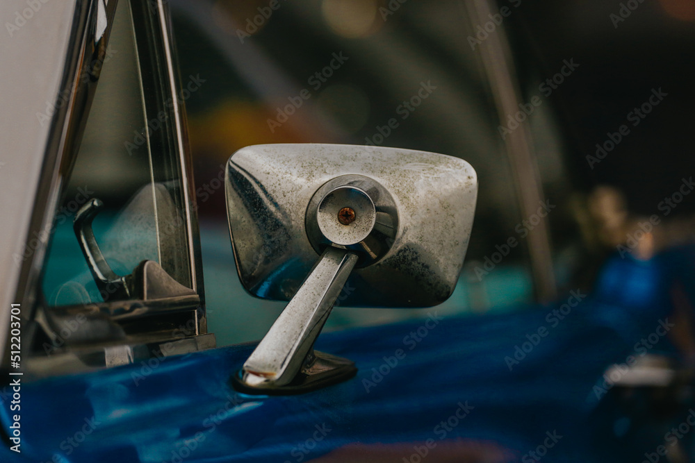 Classic car background. Close-up of the side mirror of a classic design