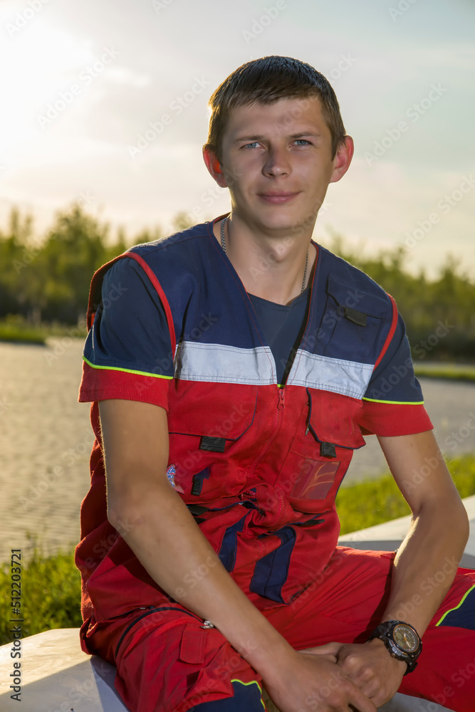 Ambulance worker, paramedic. on a background of sunset.