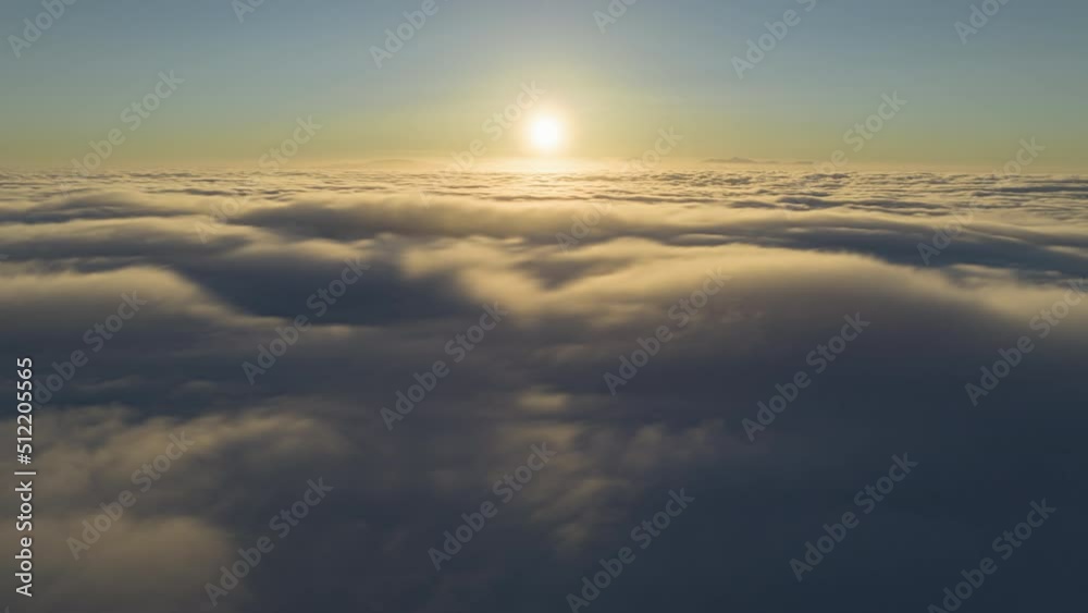 Scenic sunrise time lapse above moving fast thick fog, view on beautiful ocean of clouds at sunrise. Sun is rising above endless sea of clouds until horizon. Amazing nature landscape, 4K sky timelapse Scenic sunrise time lapse above moving fast thick fog, view on beautiful ocean of clouds at sunrise. Sun is rising above endless sea of clouds until horizon. Amazing nature landscape, 4K sky timelapse
