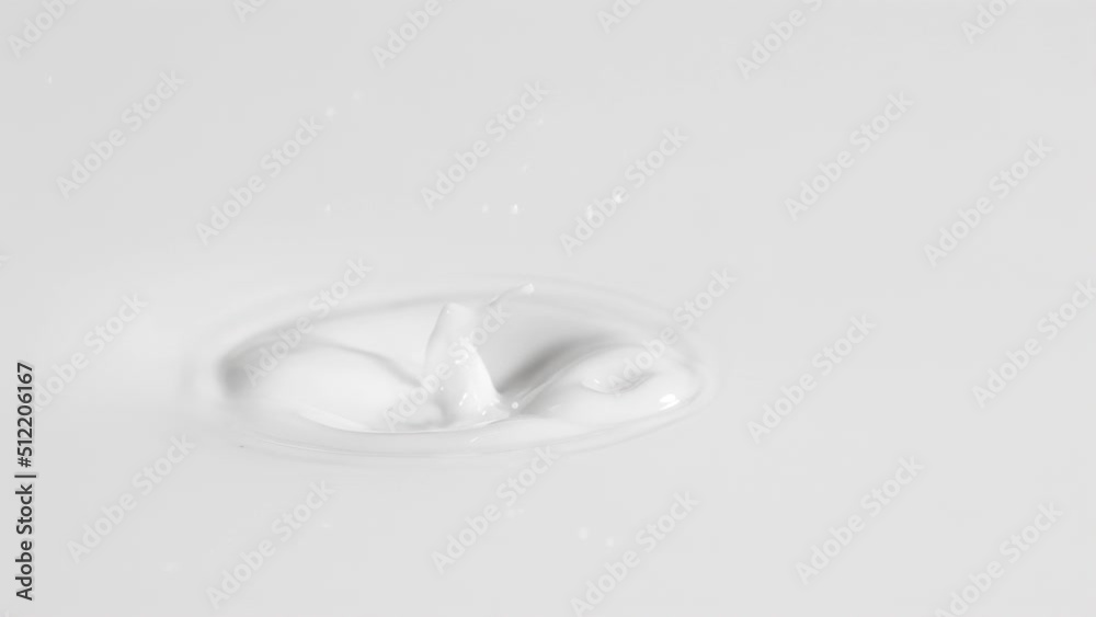 One Blueberry Splashing Into White Cream or Milk in 4K Super slow motion