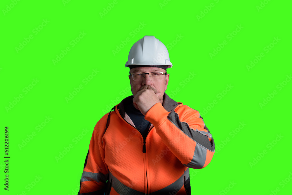 taking decision man in yellow helmet orange reflective jacket looking to the side taking decision man in yellow helmet orange reflective jacket looking to the side