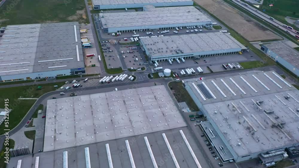 Aerial view of many logistics warehouses in industrial areas, loading and unloading goods for online store, online delivery Aerial view of many logistics warehouses in industrial areas, loading and unloading goods for online store, online delivery