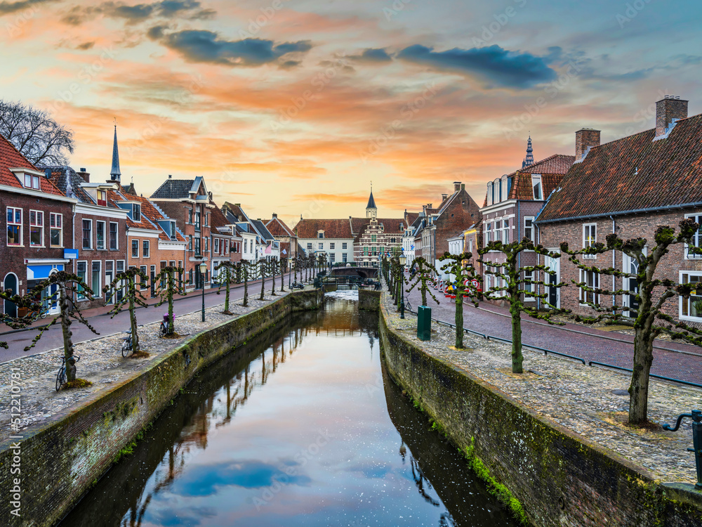 Beautiful Dutch street on canal side during sunset in Amersfoort, Netherlands