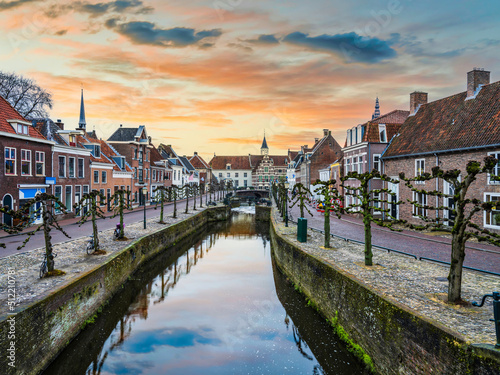 Beautiful Dutch street on canal side during sunset in Amersfoort, Netherlands