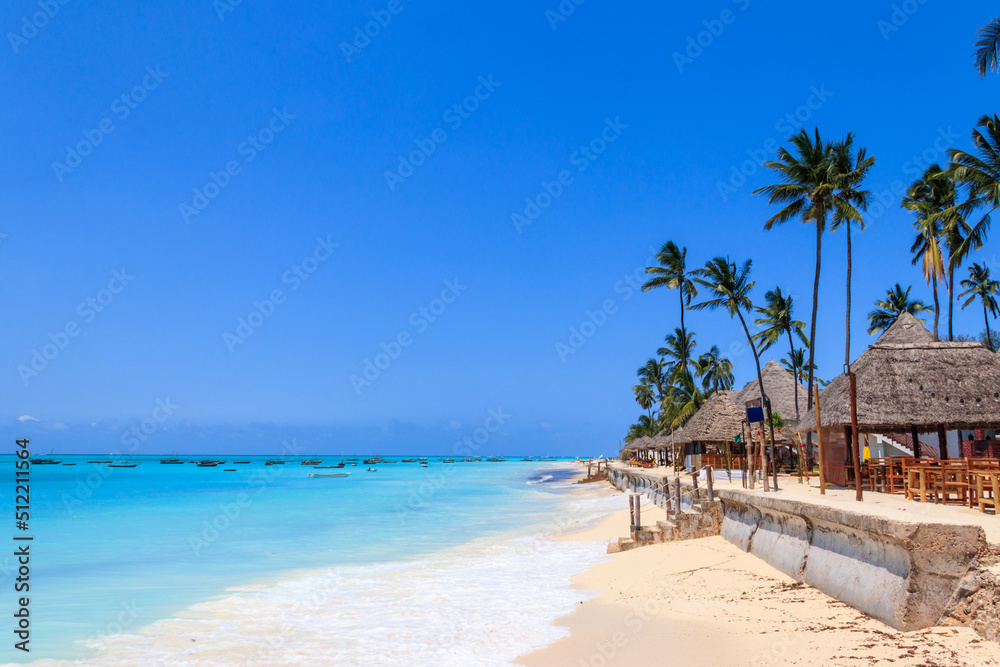 View of tropical sandy Nungwi beach on Zanzibar, Tanzania - obrazy, fototapety, plakaty 
