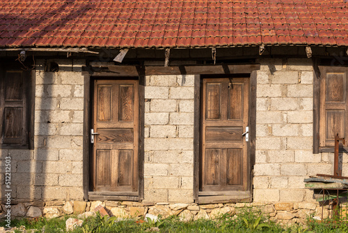 Details of wooden door and window of an old house. tile roof details