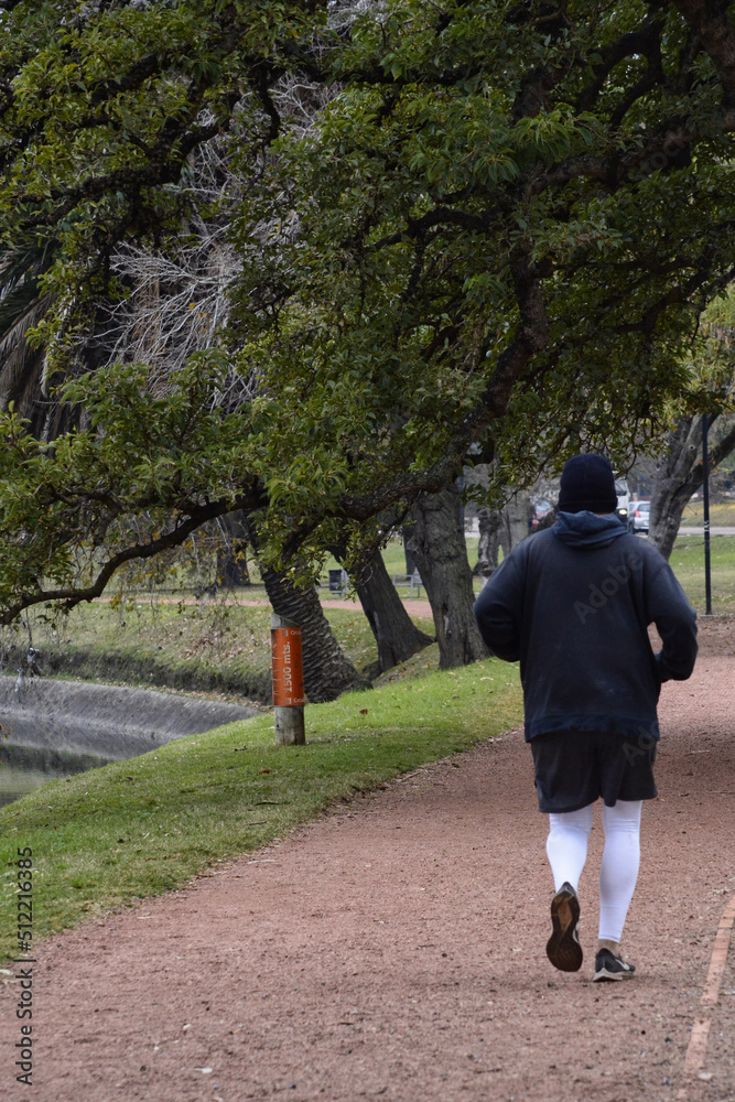 Fototapeta premium man running, doing exercise in an open park, January 10, 2022
