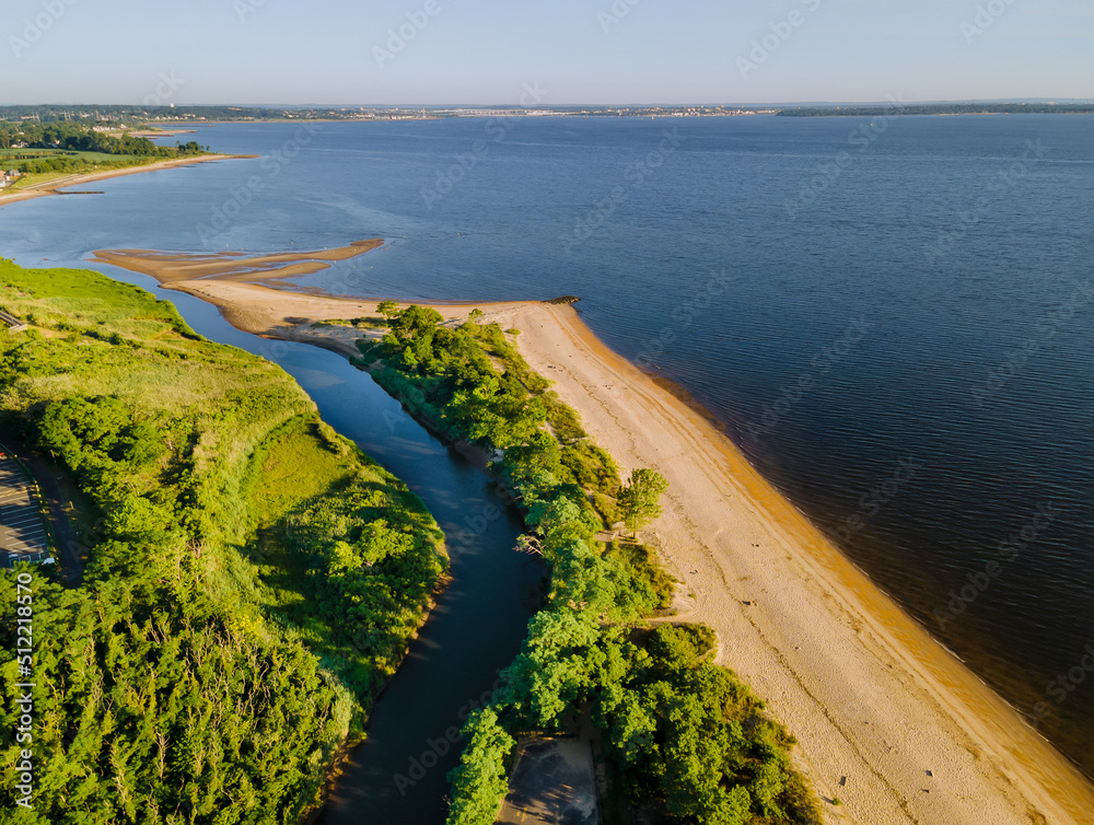 Obraz premium Panorama a clean sandy beach of the beautiful ocean coast landscape from a top height
