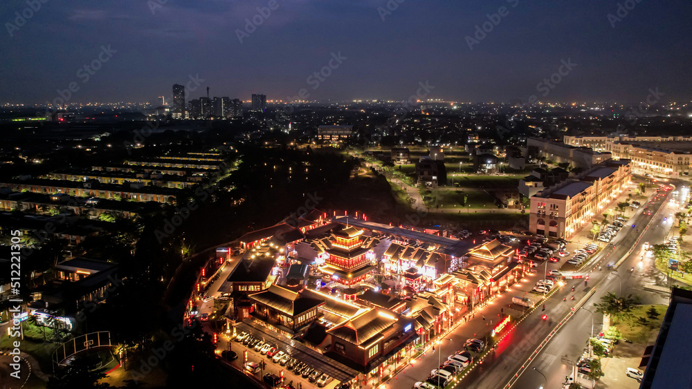 Aerial view of Shanghai old town street decorated with red chinese lanterns at night. Street market in Kelapa Gading, Chinese lanterns on the houses, Jakarta, Indonesia, June 21, 2022