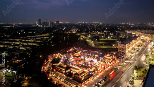 Aerial view of Shanghai old town street decorated with red chinese lanterns at night. Street market in Kelapa Gading, Chinese lanterns on the houses, Jakarta, Indonesia, June 21, 2022